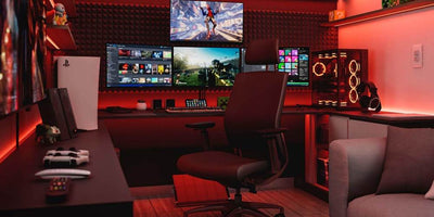 Pokój gamingowy z monitorami i konsolami.